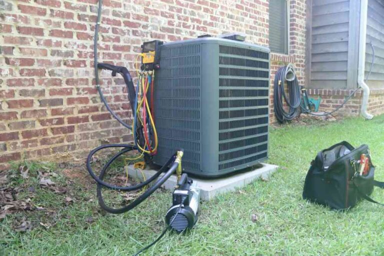 a-large-grey-rectangular-air-conditioning-unit-is-the-central-focus