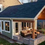 a-newly-constructed-house-covered-a-porch-and-open-patio-area-and-a-blue-siding-white-trimmed-window