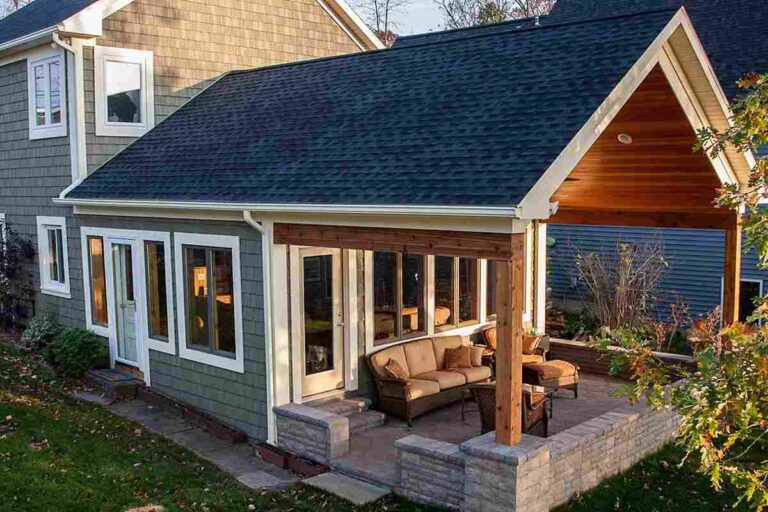 Expanding Home Life: When and Why a Home Addition Makes Sense a-newly-constructed-house-covered-a-porch-and-open-patio-area-and-a-blue-siding-white-trimmed-window