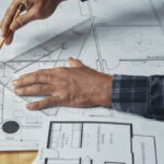 constructor-making-a-technical-drawing-on-architectural-design-plan
