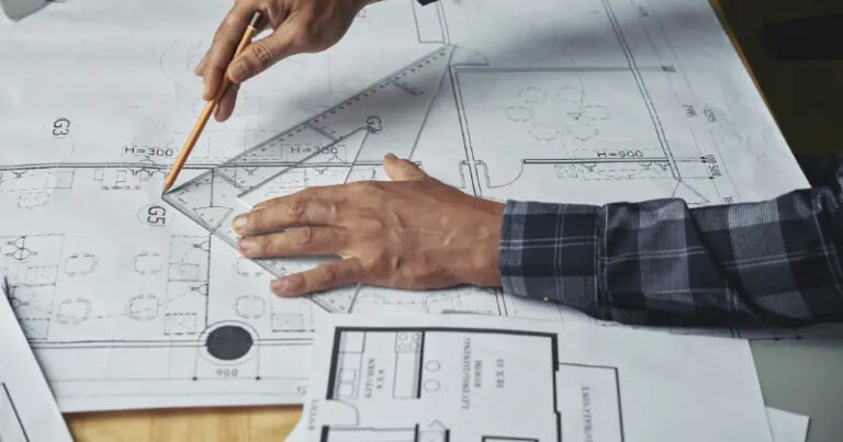 Top 5 Software for Managing Construction Drawings Efficiently constructor-making-a-technical-drawing-on-architectural-design-plan