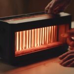infrared-heater-displaying-several-vertical-heating-elements-that-are-glowing-with-warmth