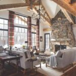 modern-cozy-living-room-large-grid-patterned-windows-and-light-colored-sofa-includes-a-pair-of-low-slung-chairs