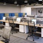 modern-open-plan-office-workspace-designed-for-teamwork-the-office-features-rows-of-shared-workstation-with-light-colored-desk-computer-monitor-keyboards-etc