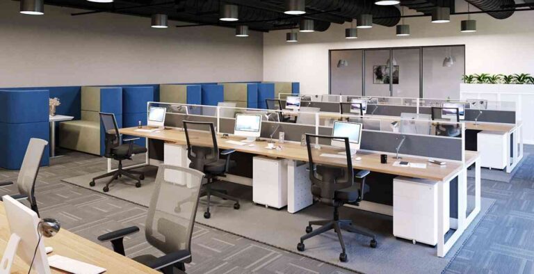 Best Office Furniture for Small Businesses in Australia modern-open-plan-office-workspace-designed-for-teamwork-the-office-features-rows-of-shared-workstation-with-light-colored-desk-computer-monitor-keyboards-etc