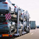 multi-level-truck-is-transporting-several-new-cars-which-appear-to-be-SUVs