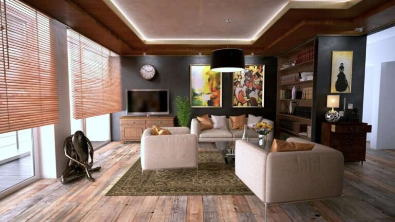 Maximize Your Space: Innovative Home Storage Solutions Explained the-room-features-light-colored-sofa-and-two-matching-armchairs-around-a-central-rug-and-telivision-is-mounted-on-the-wall