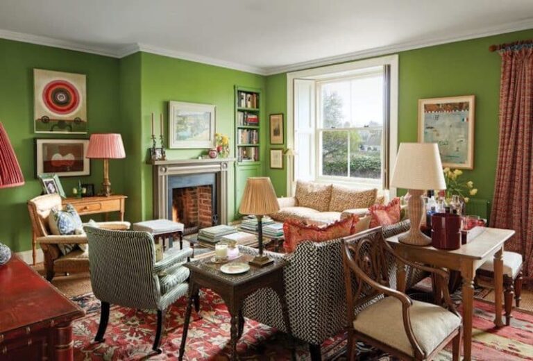 walls-are-painted-a-vibrant-green-and-ecelectic-mix-of-seating-including-a-main-sofa-and-wood-arm-chair