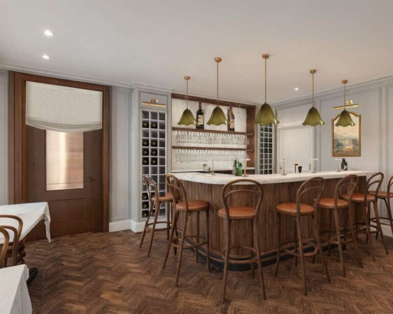 a-prominent-curved-bar-with-aight-colored-countertop-and-a-dark-possibly-wooden-or-wood-paneled-base-is-centered-in-the-room