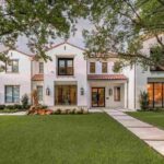 beautiful-two-story-house-with-white-exterior-the-house-has-multiple-windows-small-tiled-above-some-windows