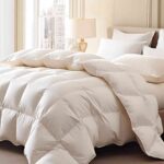 large-bed-covered-with-a-white-fluffy-duvet-and-matching-pillows-the-bedding-looking-soft-and-comfortable