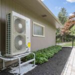 outdoor-air-conditioning-or-heat-pump-unit-mounted-on-the-side-of-a-building