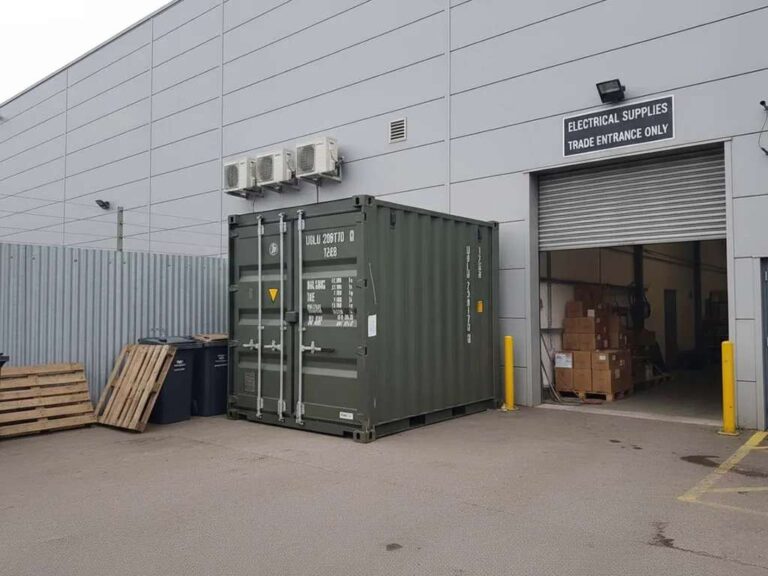 10-foot-shipping-container-positioned-next-to-a-warehouse-or-industrial-building