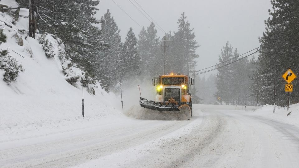 An Image Showing A Truck Removing Snow From The Road