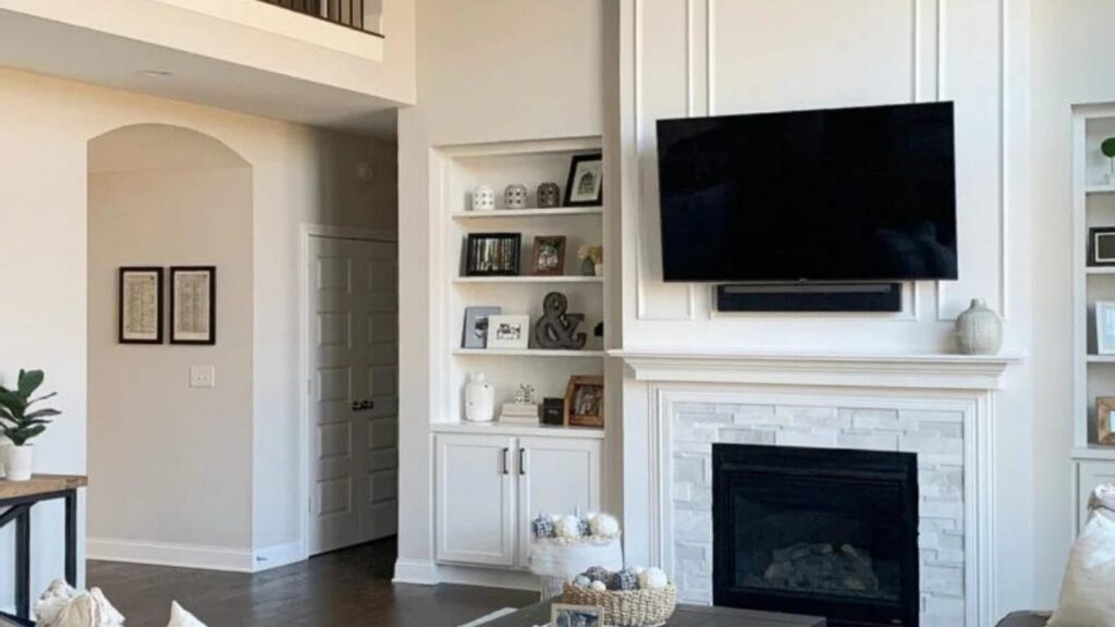 An Image of Living room Painted with off White and Taupe on Accent Wall