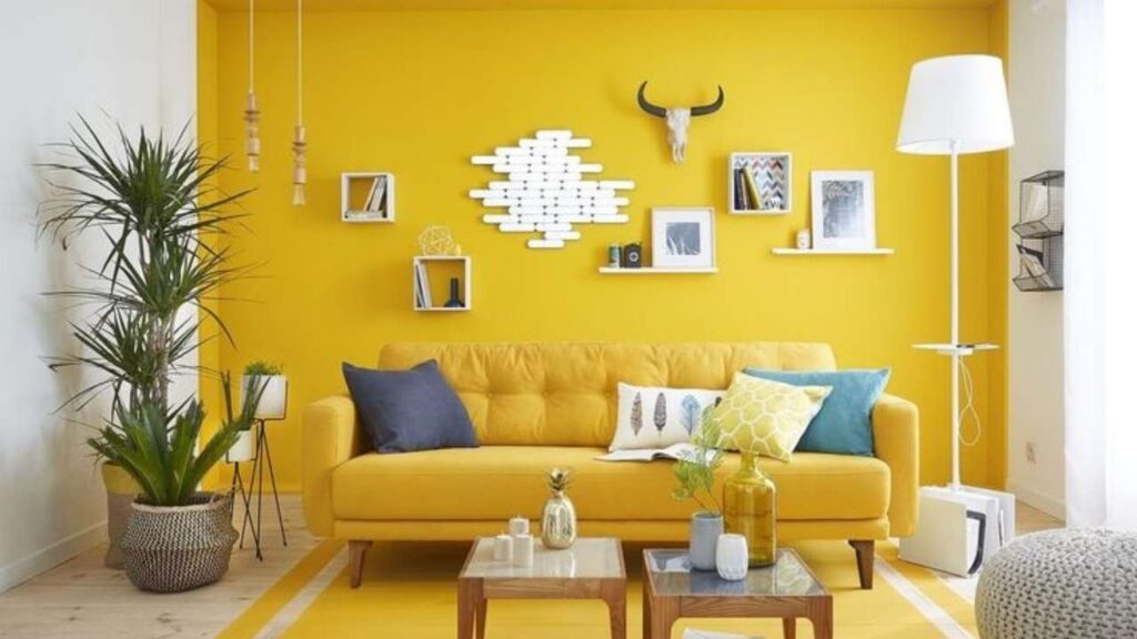 An Image of Living Room painted with off White and Yellow Accent Wall