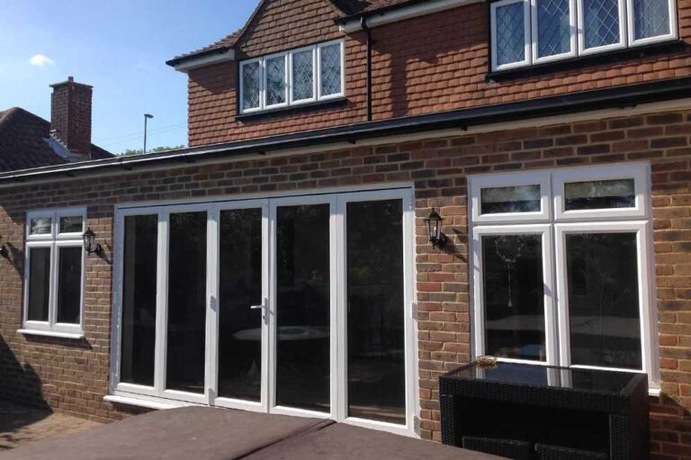 a-set-of-four-panel-bifolding-doors-which-fold-back-to-create-a-wide-open-transition-between-indoor-and-outdoor-space