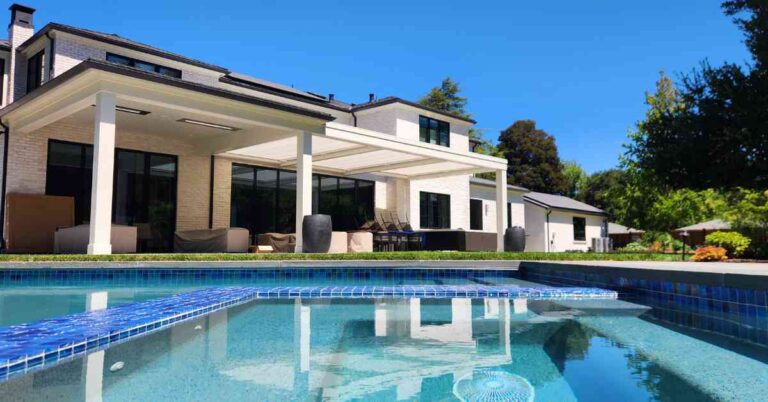 Smarter Outdoor Planning – How Homeowners Can Reduce Manual Effort the-outdoor-of-a-modern-home-features-a-geometric-heated-pool-and-a-private-patio