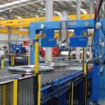 this-industrial-setup-is-specifically-designed-to-securely-bundle-and-stabilize-heavy-steel-coils