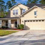 two-story-traditional-style-home-with-brick-font-and-vinyl-siding