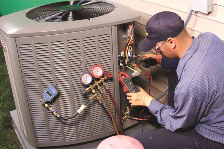 Signs Your Bowie Home Needs AC Repair Before Summer Peaks HVAC-technician-performing-maintenance-or-repair-on-an-outdoor-central-air-conditioning-unit