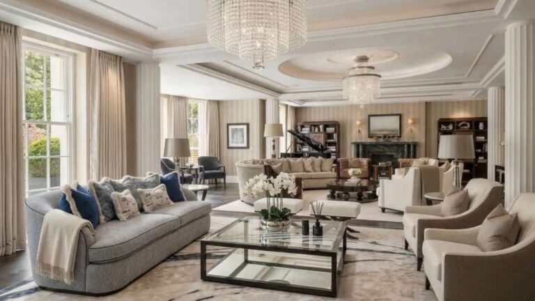 a-bright-spacious-and-living-room-interior-features-a-large-light-colored-L-shaped-sectional-sofa-is-positioned