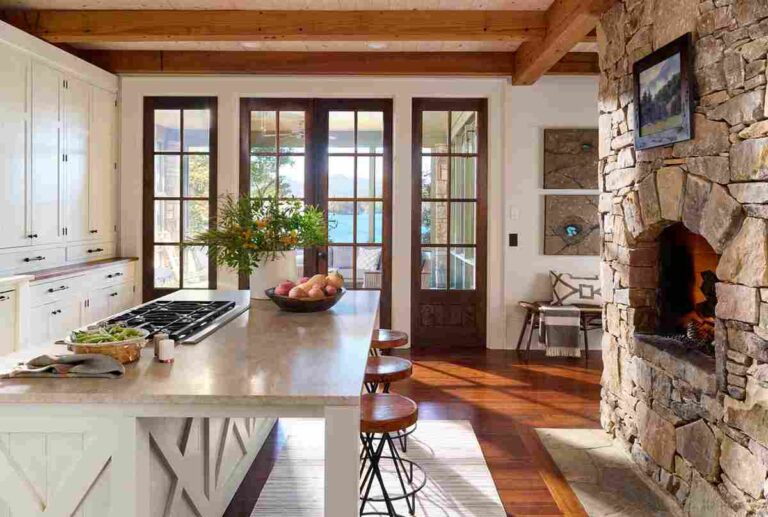 a-modern-kitchen-sitting-space-the-space-is-defined-by-exposed-wood-ceiling-beams-and-large-glass-paned-doors