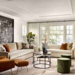 a-professionally-styled-modern-living-room-features-a-neutral-color-palette-dominated-by-white-cream-and-gray-to-create-an-airy-and-bright-atmosphere