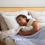 a-young-person-sleeping-peacefully-in-a-comfortable-bed-and-her-eyes-are-closed-appearig-deeply-asleep
