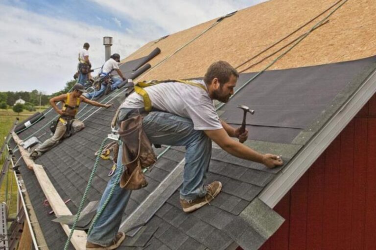 Why Modern Exterior Upgrades Feel Incomplete Without Tackling Roof Problems First group-of-roofing-contractors-working-on-a-residential-rooftop-and-also-wearing-a-tool-belt-loaded-with-supplies