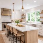 modern-bright-kitchen-featuring-a-large-central-island-with-a-white-countertops-and-seating-for-four-barstools