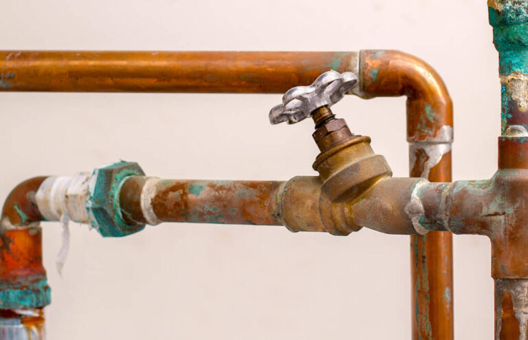 old-plumbing-pipes-it-is-rusty-and-corroded-with-a-small-metal-valve-attached-in-the-center-copper-pipes-are-also-available
