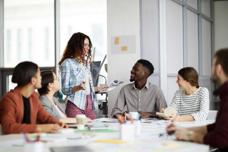 Designing Smarter: The Untapped Potential of Architectural Outsourcing professional-group-in-a-bright-modern-office-setting-representing-a-collaborative-architectural-environment