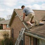 the-selected-region-shows-a-man-working-on-the-roof-of-a-single-story-brick-house