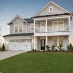 traditional-american-suburban-home-design-white-horizontal-siding-covers-most-of-the-exterior-paired-with-vertical-board-and-batten-siding-on-the-gables