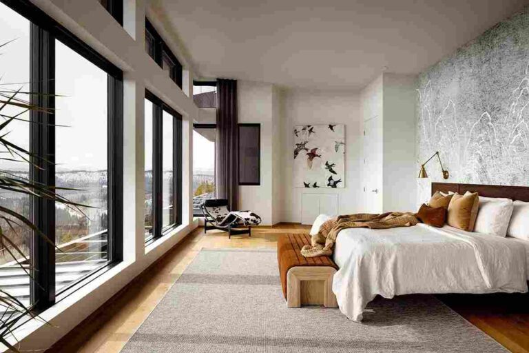 How to Give Your Bedroom a Luxury Refresh Without a Full Renovation a-high-ceilinged-penthouse-main-bedroom-with-an-etire-wall-made-of-floor-to-ceiling-window-offering-panoramic-outdoor-view
