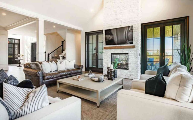 a-large-modern-open-concept-living-area-with-a-clean-and-airy-design-the-space-is-anchored-by-a-large-crisp-white-L-shaped-sectional-sofa