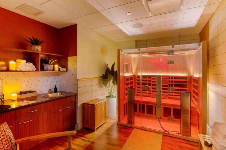 Red Light Infrared Sauna Home Value: How Built-In Recovery Suites Drive Appraiser Equity a-modern-wood-framed-sauna-equipped-with-clear-glass-front-wall-and-door-the-interior-glows-with-an-intense-red-light