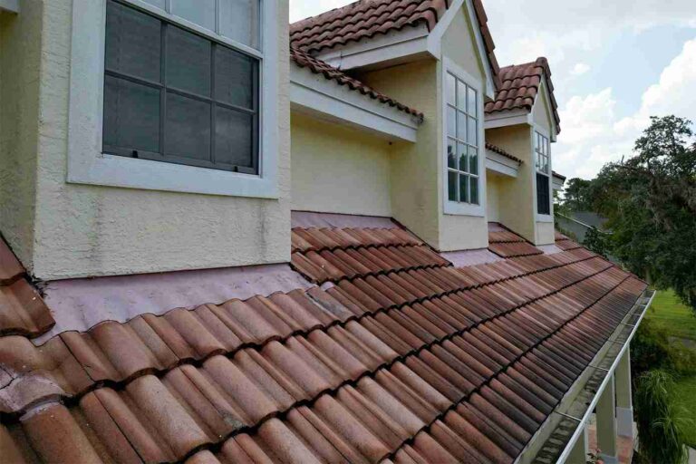 How to Decide if Tile Roofing Is Right for Your Home a-residential-home-featuring-a-roof-that-is-covered-in-reddish-brown-s-shaped-interlocking-barrel-tiles