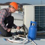 a-technician-is-wearing-a-safety-helmet-and-inspecting-or-connecting-components