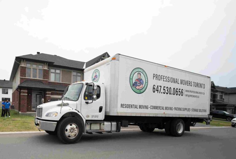How To Prepare Your Toronto Home For A Peak-Season Move a-white-straight-moving-truck-parked-on-a-paved-residential-street