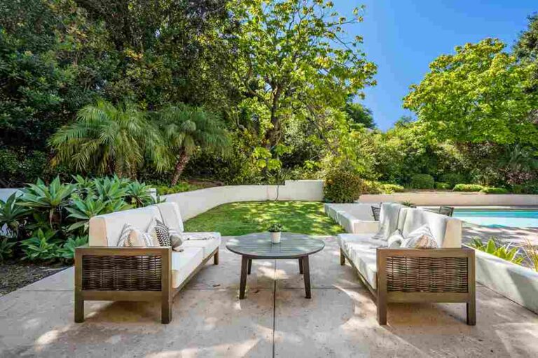 Smart Backyard Investments That Pay Off at Resale outdoor-patio-living-space-designed-for-relaxation-it-features-a-modern-seating-arrangement-with-two-woven-textured-sofas