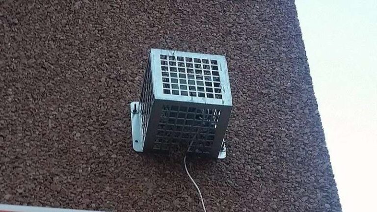 The Best Discrete Outdoor Anti-Loitering Solutions for Residential Homes an-electronic-security-device-enclosed-inside-a-protective-metal-vandal-cage