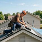 a-construction-worker-actively-repairing-an-asphalt-shingle-roof-on-a-residential-house